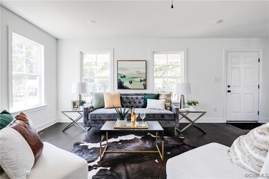 Living room featuring dark hardwood / wood-style f