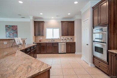 Kitchen features lots of cabinets, counter space a