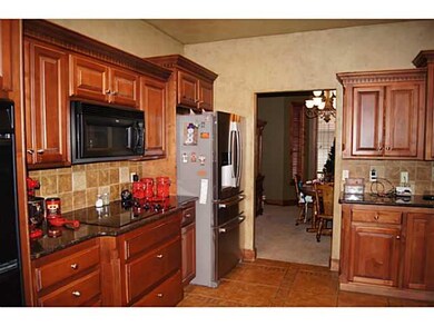 Kitchen. Granite counters, maple cabinetry, stone 