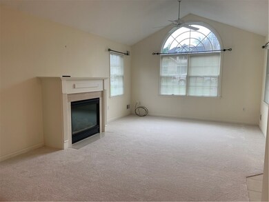 New carpeting in the formal living room. Vaulted c