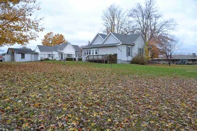 View of back yard and fenced area.