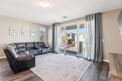 Living room featuring dark hardwood / wood-style f