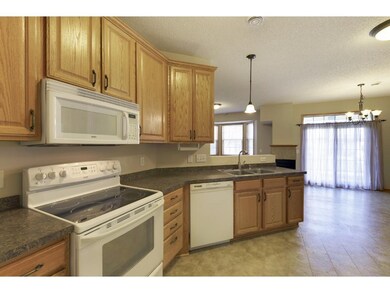 Alternate view of kitchen into dining room with sl