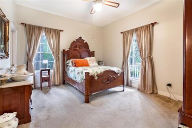 The large master bedroom features a walk-in closet