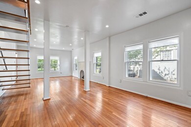 Unfurnished living room featuring a fireplace, vis