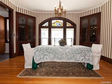 Look at that stunning art glass trio of windows in