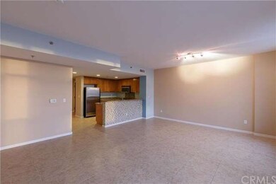 Open floor plan with upgraded tiled flooring and l