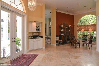 Living room with built-ins and golf course views