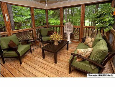 This screened in porch is the perfect place to relax!