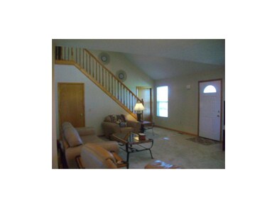 Living room and stairs to upper level.
