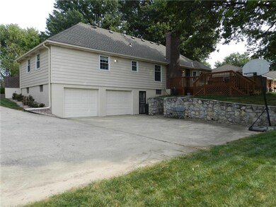 Low-maintenance metal siding and large driveway!