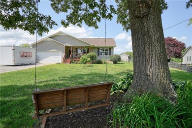 Ranch-style house with a porch, concrete driveway,