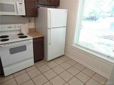 Kitchen with breakfast nook, tile floor and natura