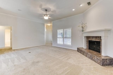 Unfurnished living room featuring baseboards, carp