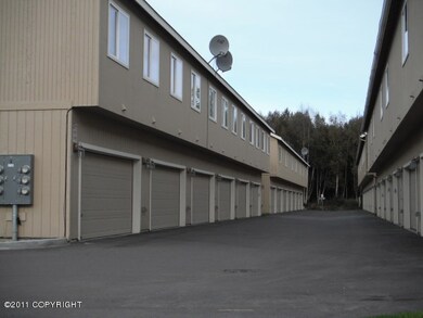 Garage entrances at the rear of the unit