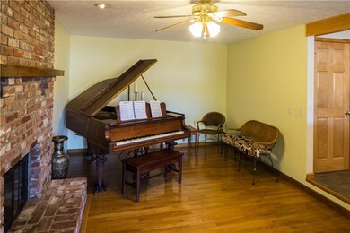 Family room with beautiful fireplace and hardwood 