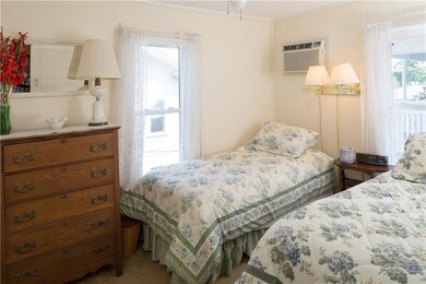 Second bedroom with two windows, wall lamp, ceilin