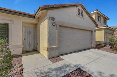 Doorway to property with stucco siding, an attache