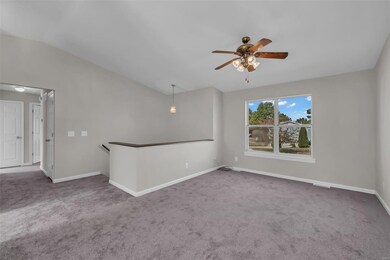 Vaulted living room area offers open floor plan an