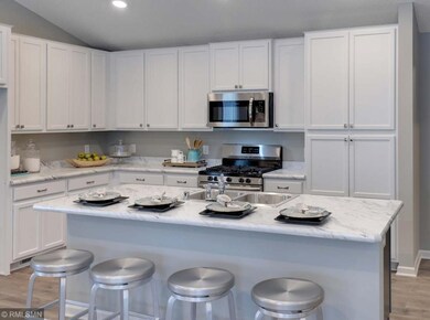 Open and naturally bright, the home's kitchen spac