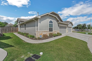 View of home's exterior with a garage, driveway, 