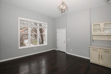 Living room overlooks Fulton Ave.  Wood floors, hi
