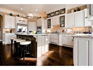 Kitchen. Home is under construction. Photos are for floor plan/design reference. Actual colors & options vary