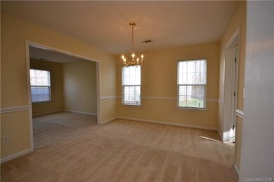 Dining room opens to front living room and kitchen