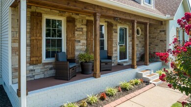 Manicured landscaping, stone front with cedar shutters and posts provide great curb appeal. The concrete curbing, concrete driveway and sidewalks have been pressure washed for you!