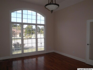 The study/office is just to the right of the foyer and also has WF and beautiful views. The half bath is close by.