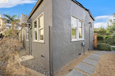 View of property exterior with crawl space and stucco siding