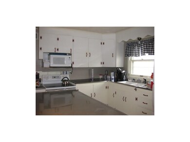 Kitchen with stainless steel-like counter top