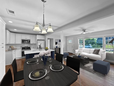 Dining room featuring a wealth of natural light, ceiling fan, and hardwood / wood-style floors