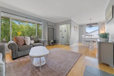 Living room with plenty of natural light, hardwood