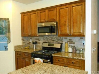 Beautiful Kitchen With Window View of Greenbelt