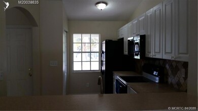 Pantry on left side of kitchen. Washer & dryer are