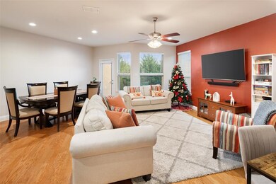 The family room is spacious and offers wood floors