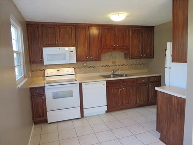 The Kitchen Features Ceramic Tile Flooring & Decor