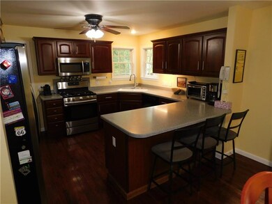 CHERRY CABINETS/CHERRY HARDWOOD STAIN FLOORING. SE