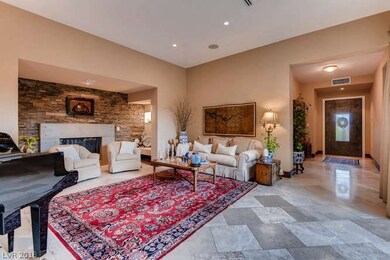 Formal living room with stone accent and gas firep