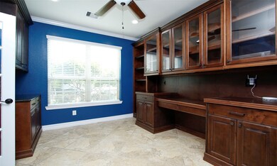 The study has a custom desk and built ins.  On the right of this picture is the custom coffee bar with special drawers made to hold k-cups.