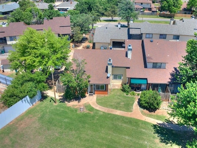 Aerial view of property and surrounding area with nearby suburban area