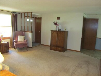 Living Room. CERAMIC FLOORING AT FRONT DOOR FOYER.