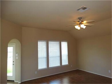 Living Area w/ Ceiling Fan & Wood Flooring