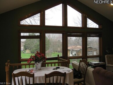 Kitchen overlooks the expansive backyard
