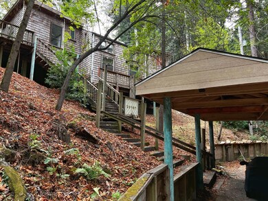 Front View of main house and Carport.  Guest house