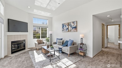 Gather, unwind, and enjoy the abundance of natural light in this serene living room.