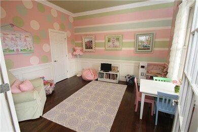 OFFICE CURRENTLY USED AS A PLYROOM ~ FEATURES A CLOSET AND FRENCH DOORS + REAL HARDWOOD FLOORS
