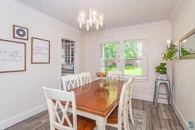 Dining area featuring an inviting chandelier, crow