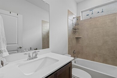 Full bathroom with vanity, tiled shower / bath com